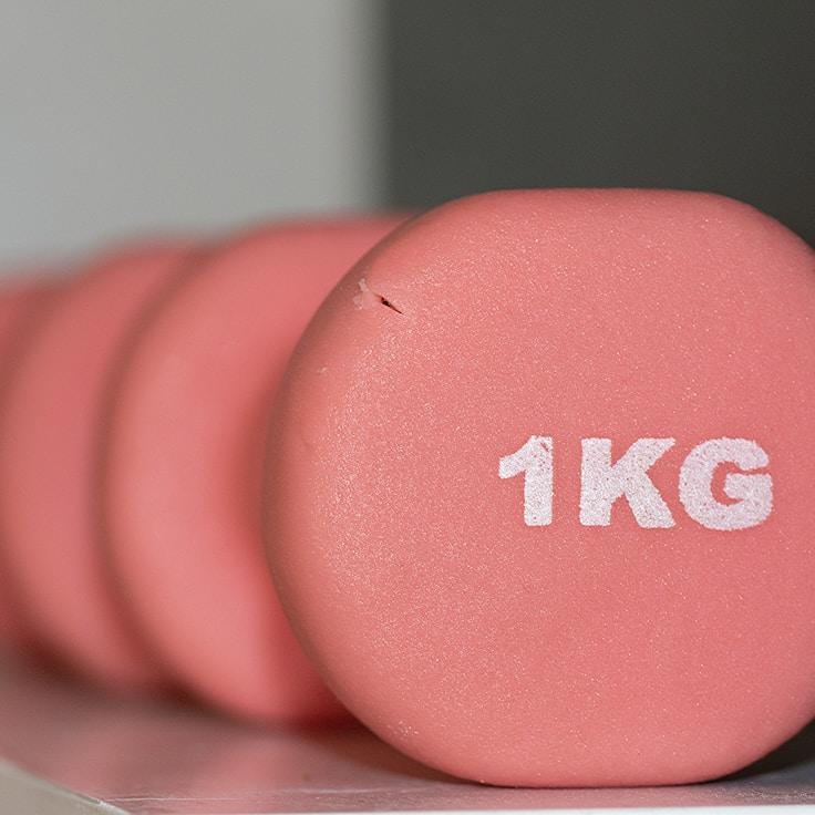 Interior of a professional gym with weight training equipment and mirrors